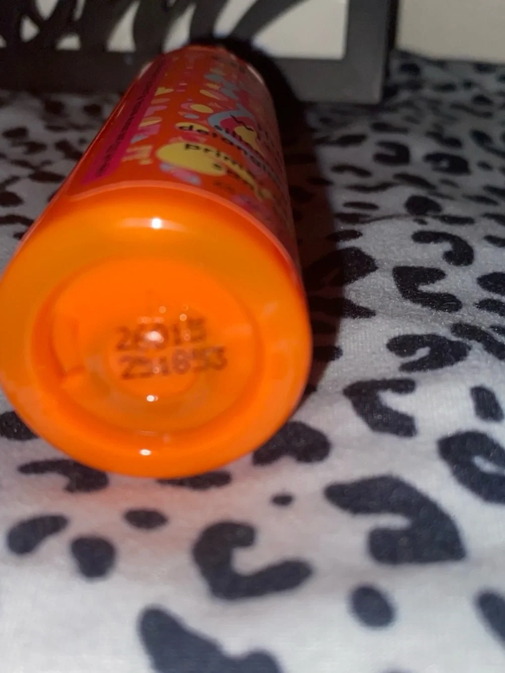 amika Bright Orange Bottle with Pink Cap Detangling Primer